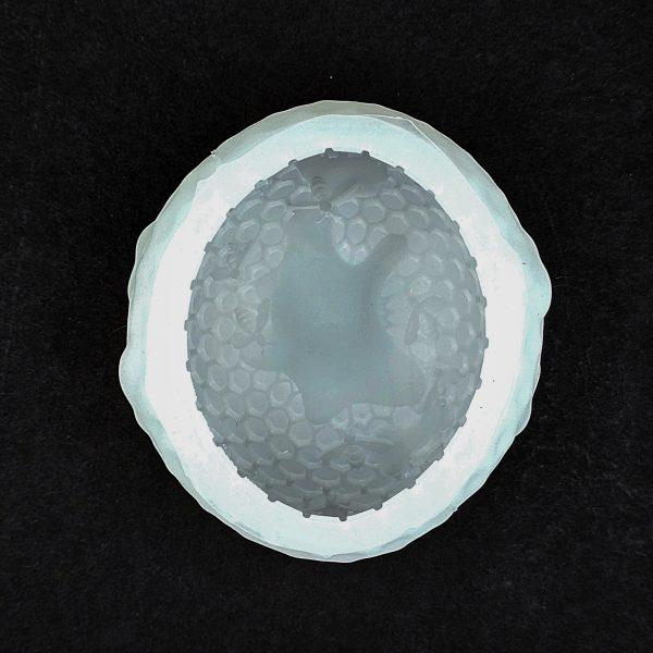 Skep Shaped Wax Candle Mold with Honey Flowing Out of the Top