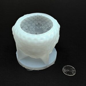 Skep Shaped Wax Candle Mold with Honey Flowing Out of the Top