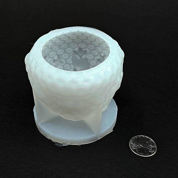 Skep Shaped Wax Candle Mold with Honey Flowing Out of the Top