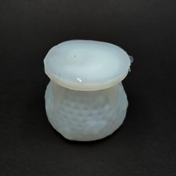 Skep Shaped Wax Candle Mold with Honey Flowing Out of the Top